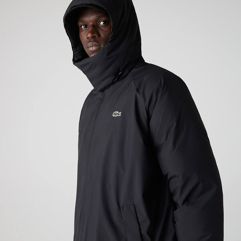 Puffer coat with an enveloping hood and high collar